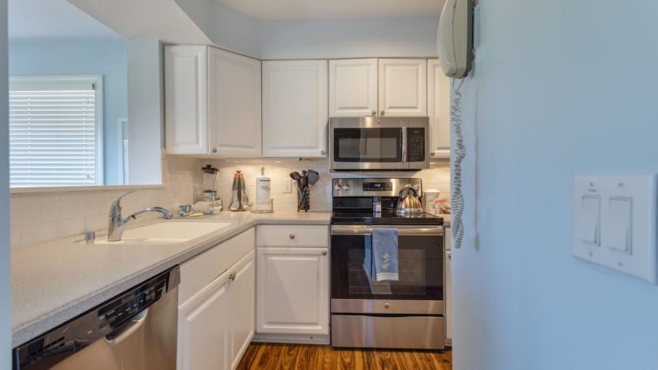An efficient layout with generous counter space opens to the living area, making it ideal for easy meal prep, casual dining, and staying connected with family and guests.