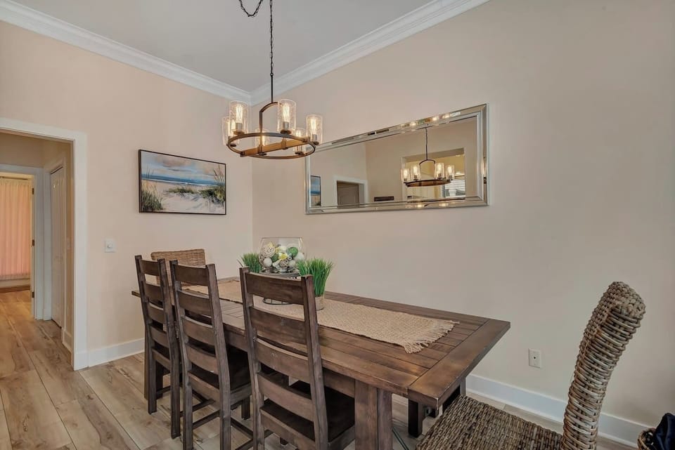 The dining table has 5 chairs plus a bench for pleenty of seating. 3 more chairs are on the back porch.