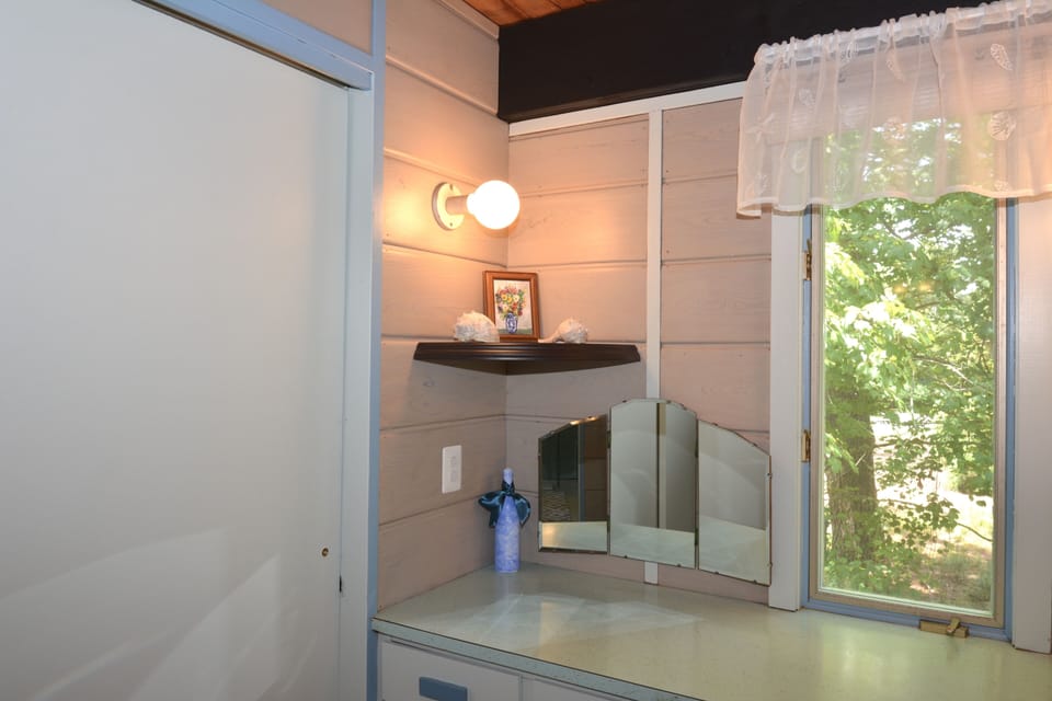 The dressing room, featuring a spacious closet, lies between the master bedroom and bath.