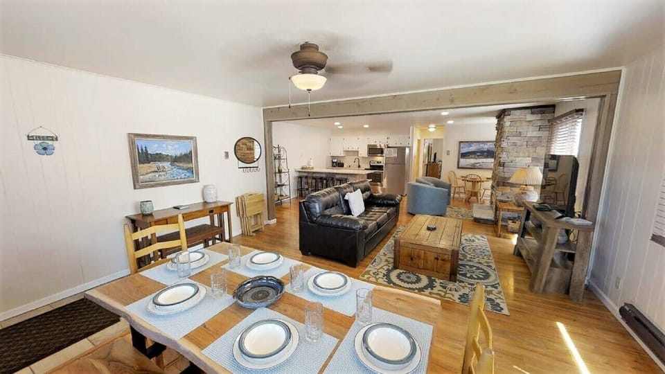 Gather around the dining table for meals, then relax in your inviting living space, complete with cozy seating, a warm fireplace, and an open layout connecting you to the full kitchen.