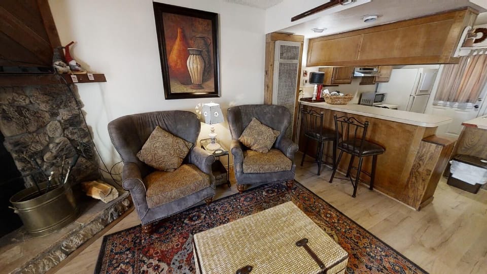 Unwind by the stone fireplace with a book, then step into your open kitchen for coffee. Every corner invites you to settle in and feel truly at home.