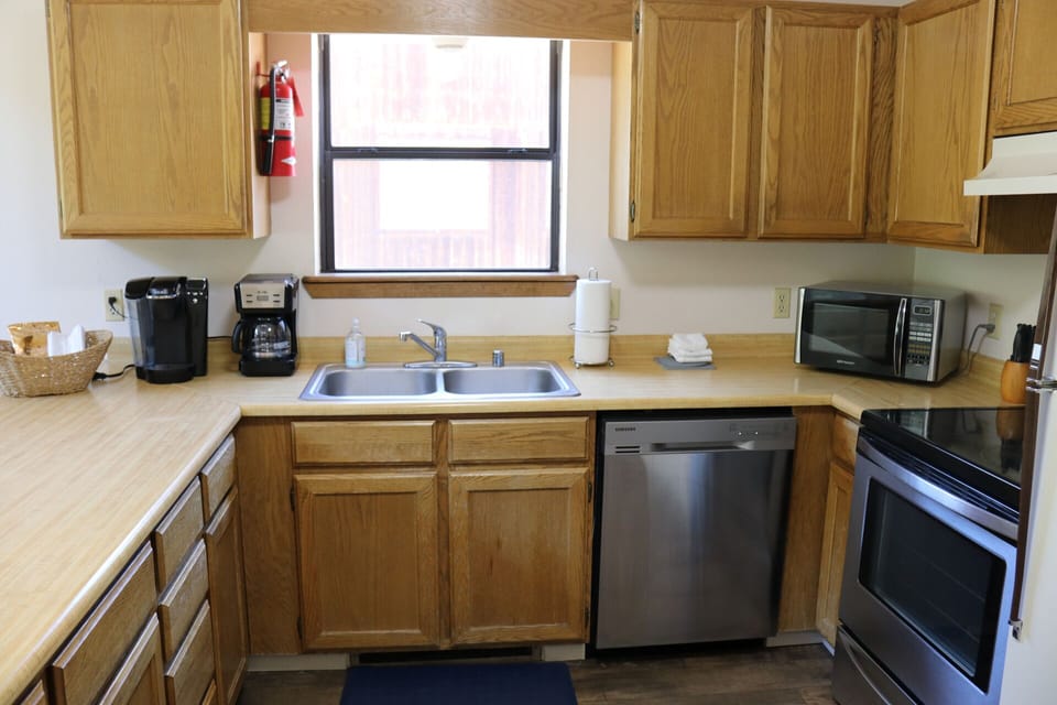 Your fully equipped kitchen awaits with modern appliances, ample counter space, and everything you need to prepare delicious meals during your stay.