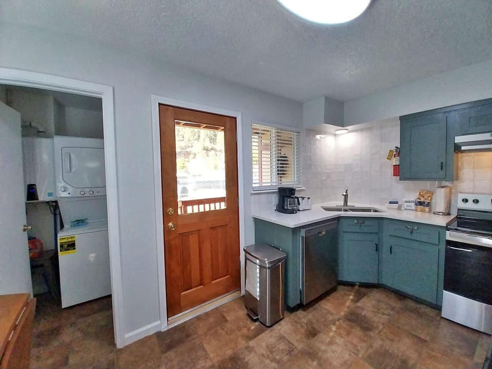 Your fully equipped kitchen has everything you need to whip up memorable meals, with stainless appliances, ample counter space, and convenient laundry access right next door.