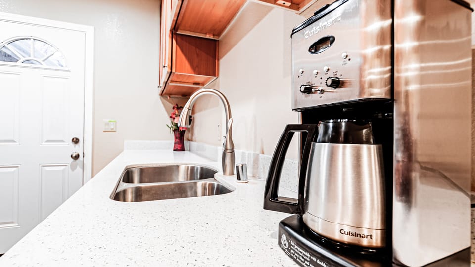 Kitchen with cooking wares and utensils