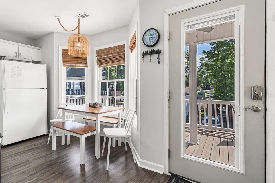 Bright kitchen nook with cozy dining and deck access