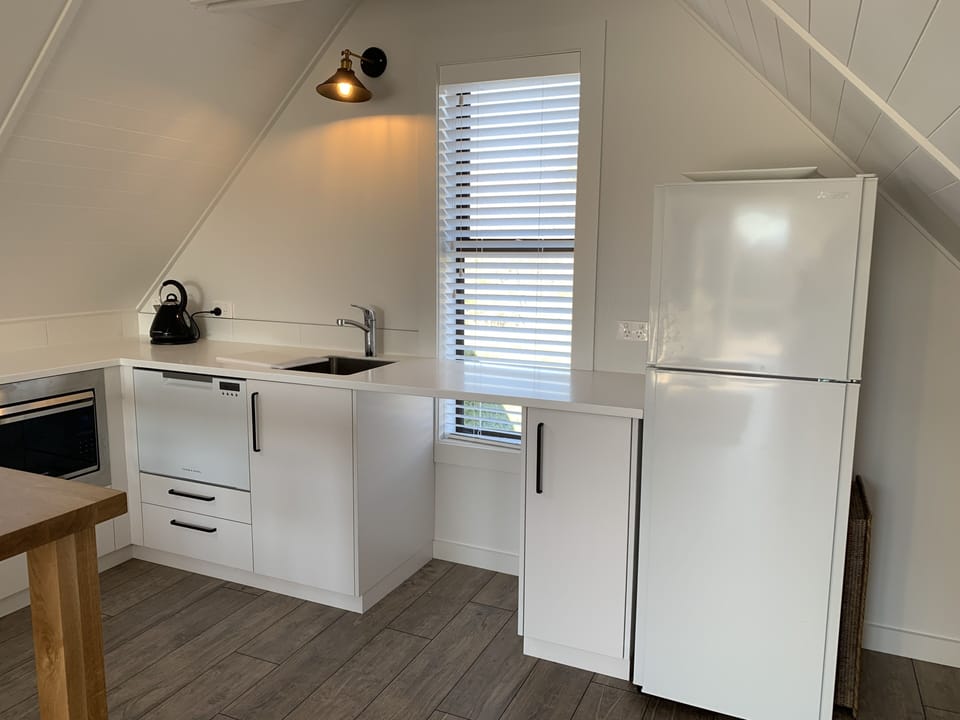 Fridge/freezer. Other appliances in drawers and cupboards. Crockery for 6 people