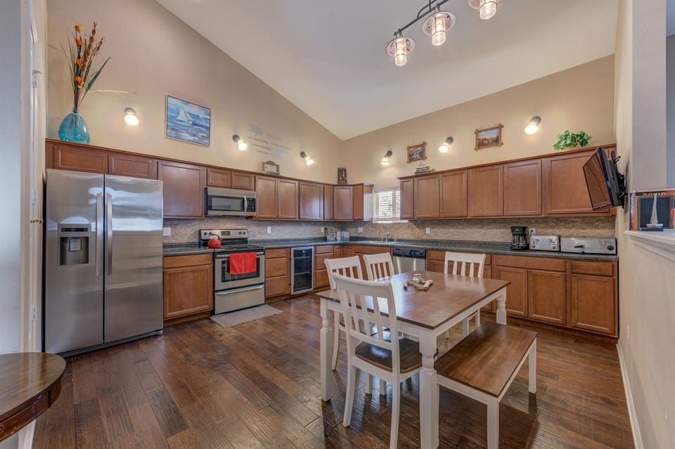 The kitchen is very spacious, and fully stocked with pots, pans, spices, dishware and bakeware for your dining needs.