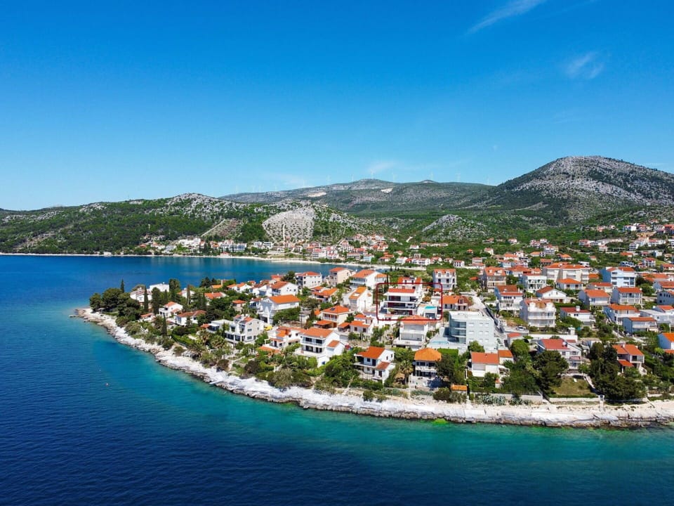 Water, Sky, Building, Water Resources, Property, Azure, House, Lake, Mountain, Coastal And Oceanic Landforms