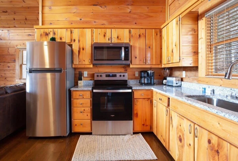 Kitchen With Stainless Appliances And Granite Countertops!