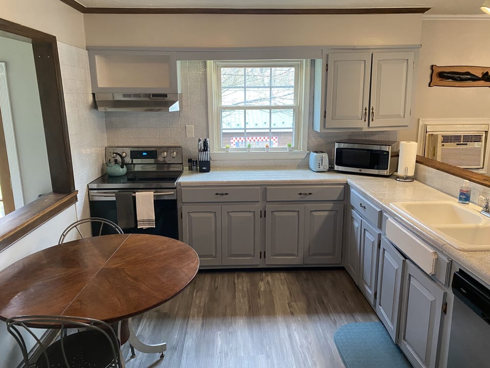 KITCHEN - 2nd Floor spacious, fully stocked with cooking pans, and eating dishes