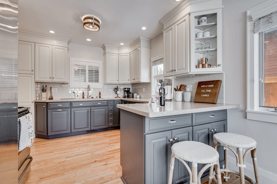 Your gourmet kitchen awaits with elegant cabinetry, granite countertops, and a welcoming breakfast bar perfect for morning coffee or casual meals.