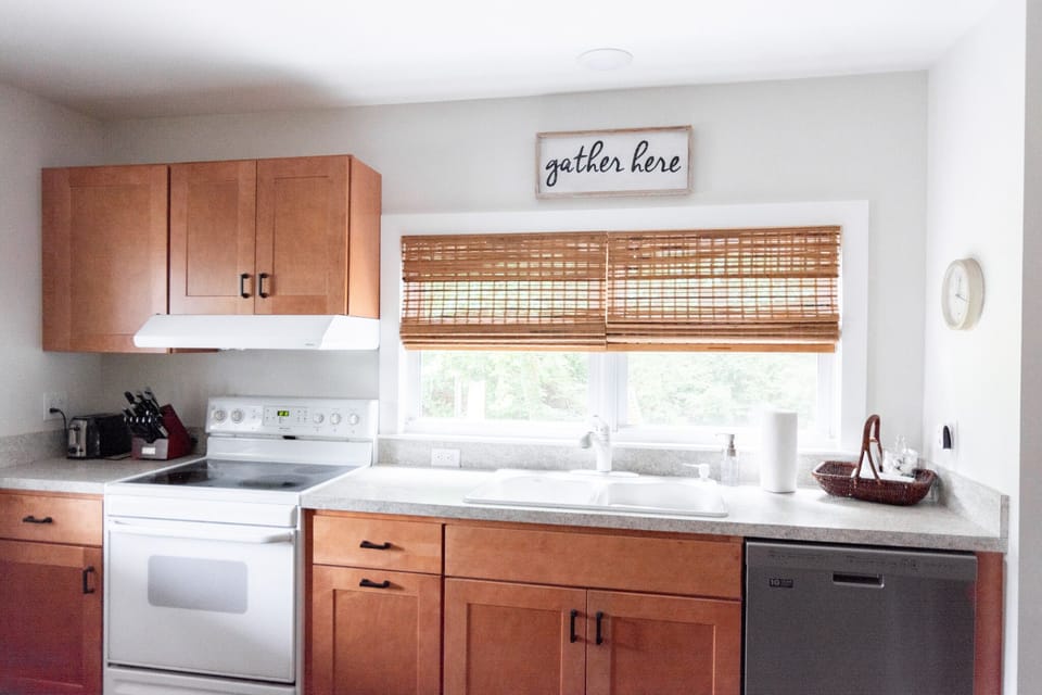 Kitchen has fridge, dishwasher, stove/oven, microwave, pantry, & island