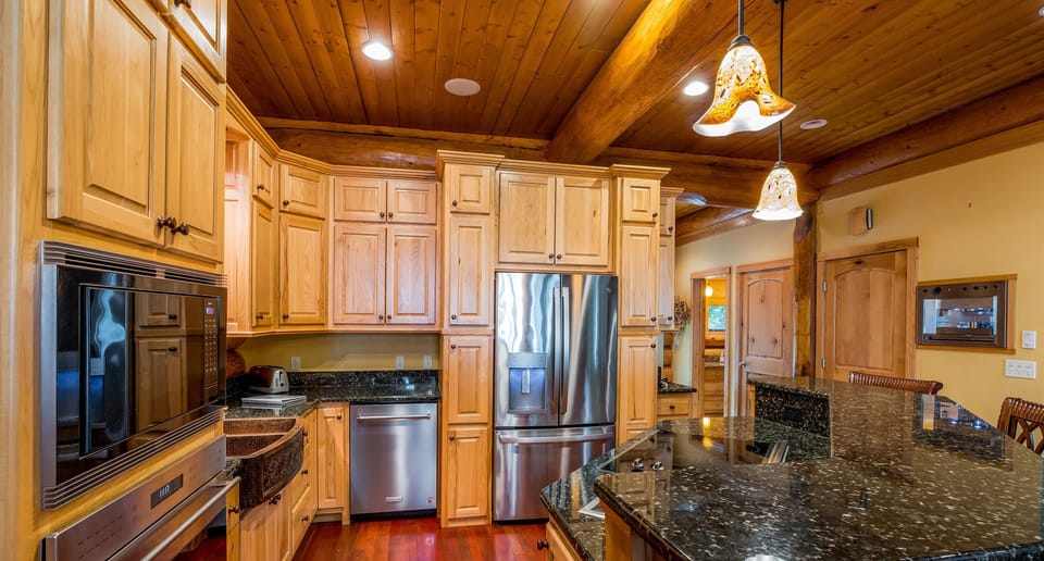 Fully equipped kitchen with granite counters + stainless appliances