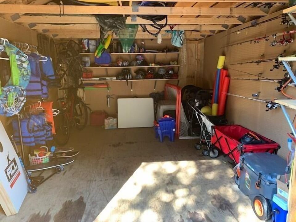 Adventure Shed!! Full of fishing gear, coolers, games, golf gear, tables, bikes, etc.