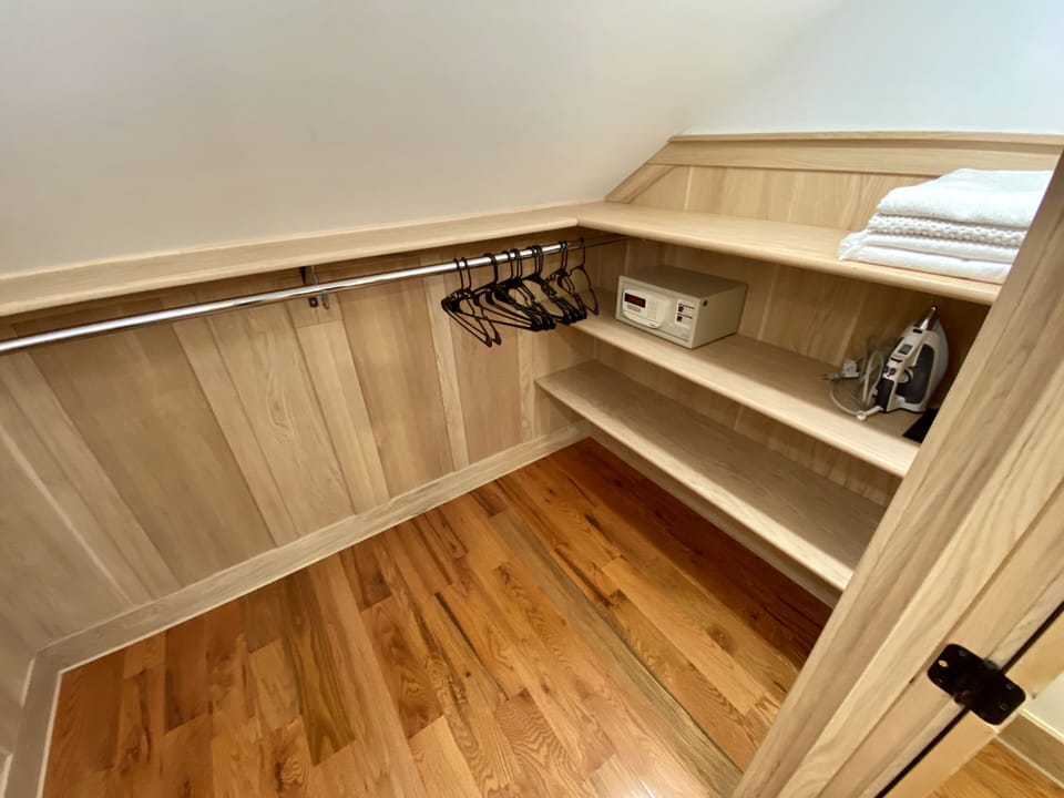 Upstairs Queen bedroom walk in closet. Small hotel safe for guests use.