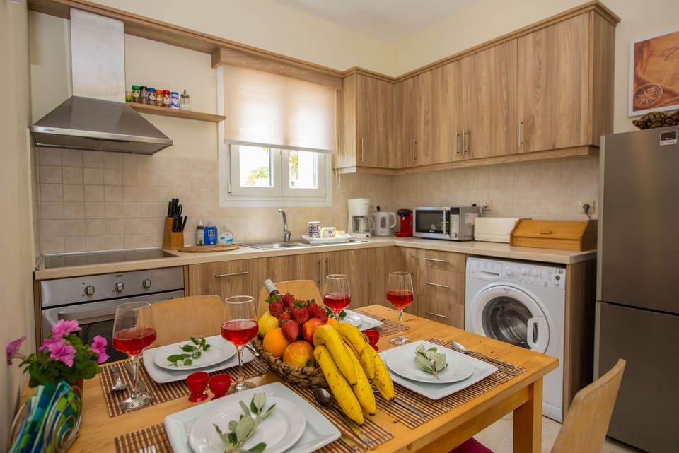 Villas Porto Odysseas Afionas Corfu Kitchen And Dining Area