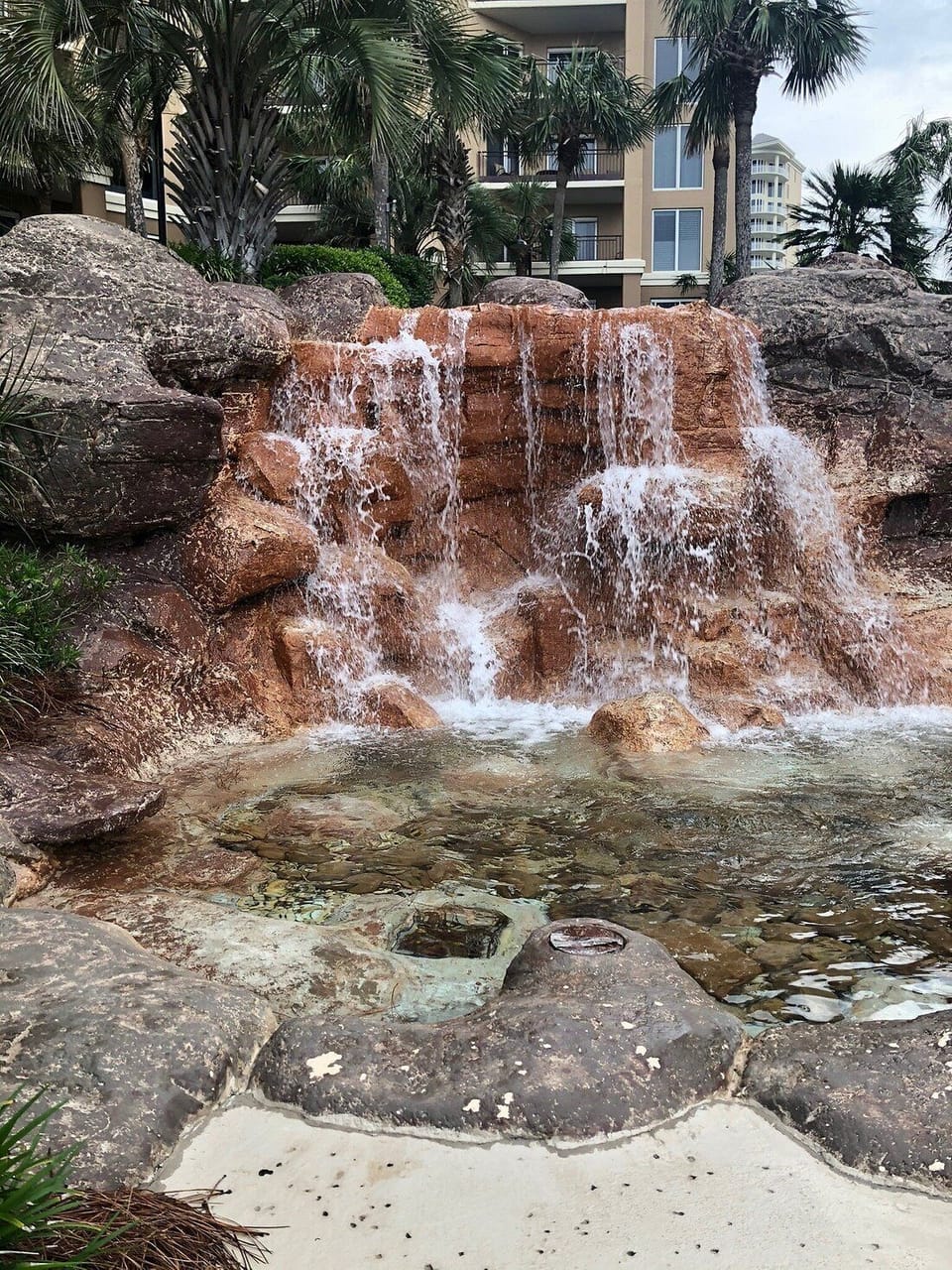 Beautiful waterfall beside the hot tub.
