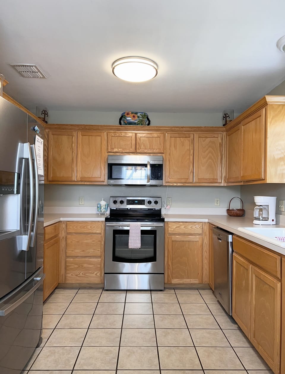 Full Kitchen with plenty of storage and stainless appliances.