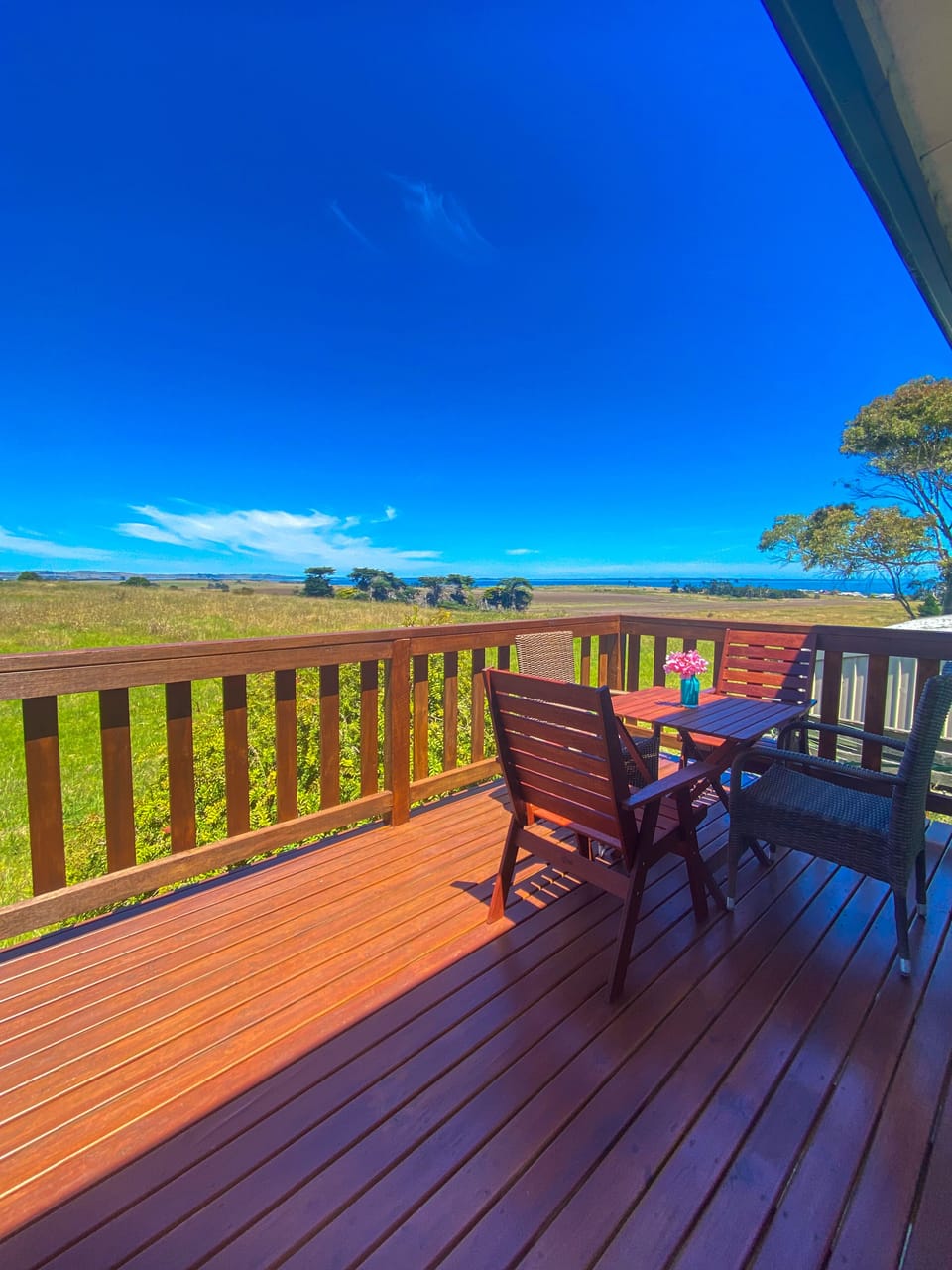 Stunning views of Coronet Bay beach from the back balcony on the first floor.