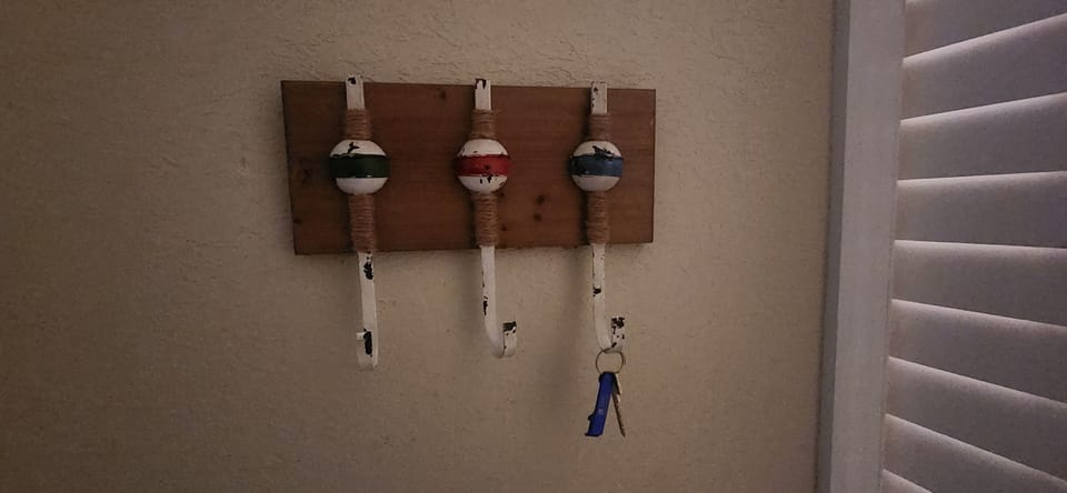 pool key hangs by front door