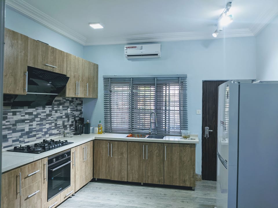 Kitchen: Air conditioner, refrigerator and utensils
