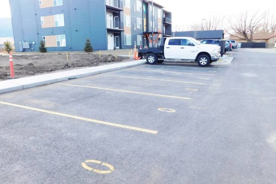 Parking spaces with an "O" for open. If it has a number, it is reserved.