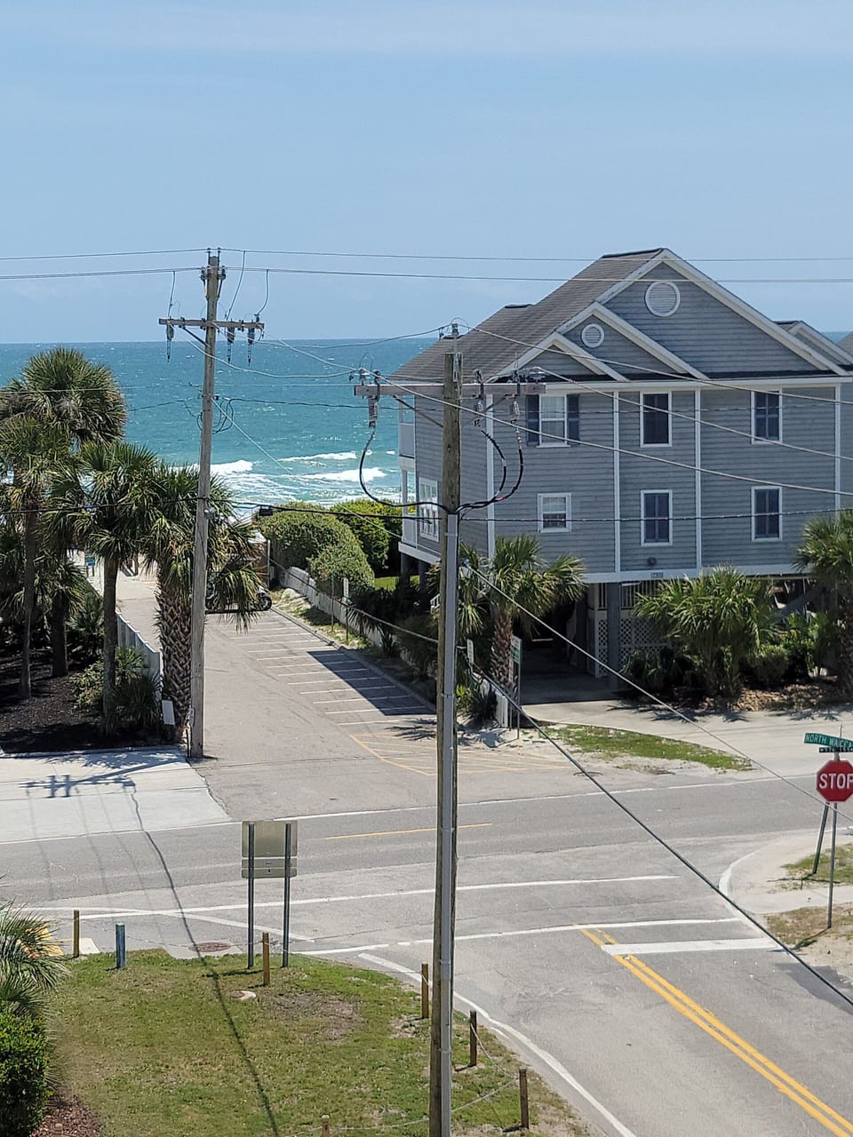 Beach entrance with golf cart parking. 