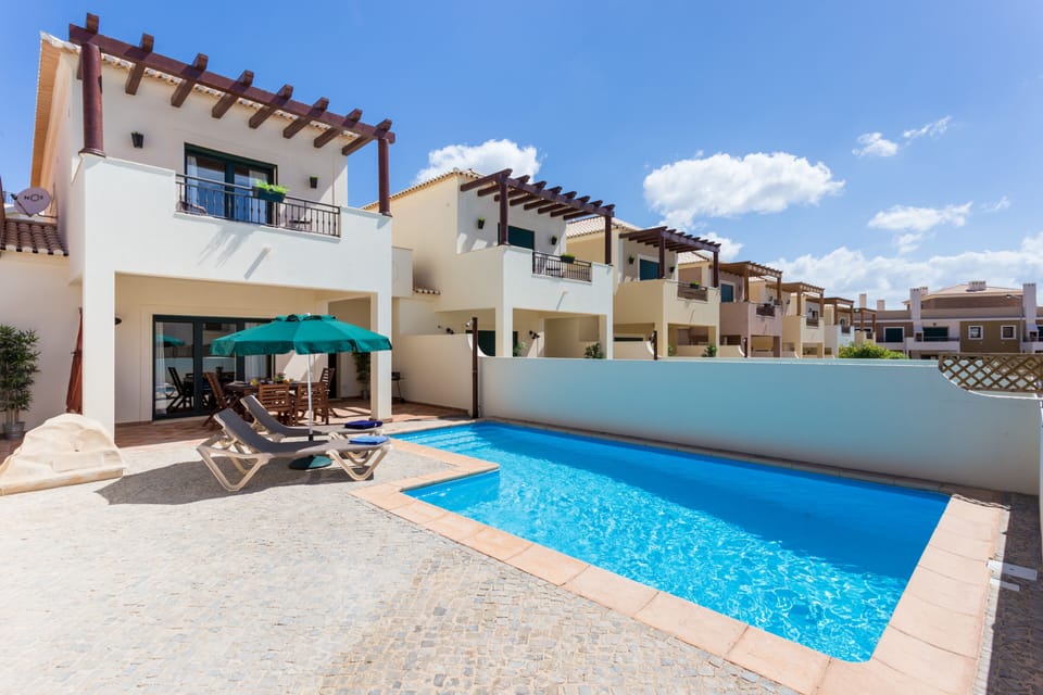 Private Pool and sunny patio and just a short walk to the beach!