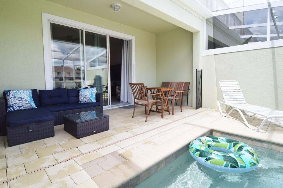 Private dip pool with corner sofa, two sun loungers, table and chairs