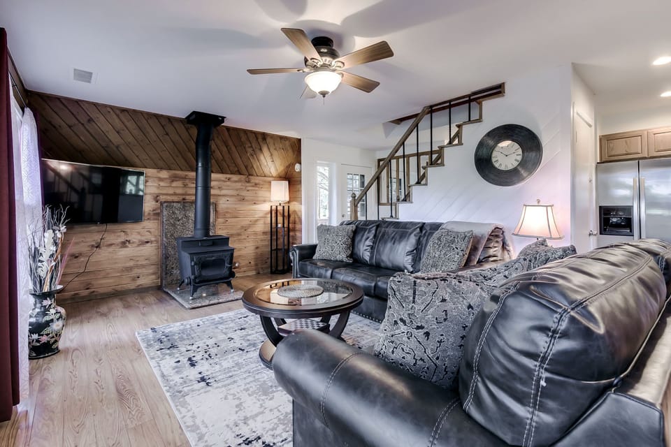 Living room with 56inches TV and wood stove