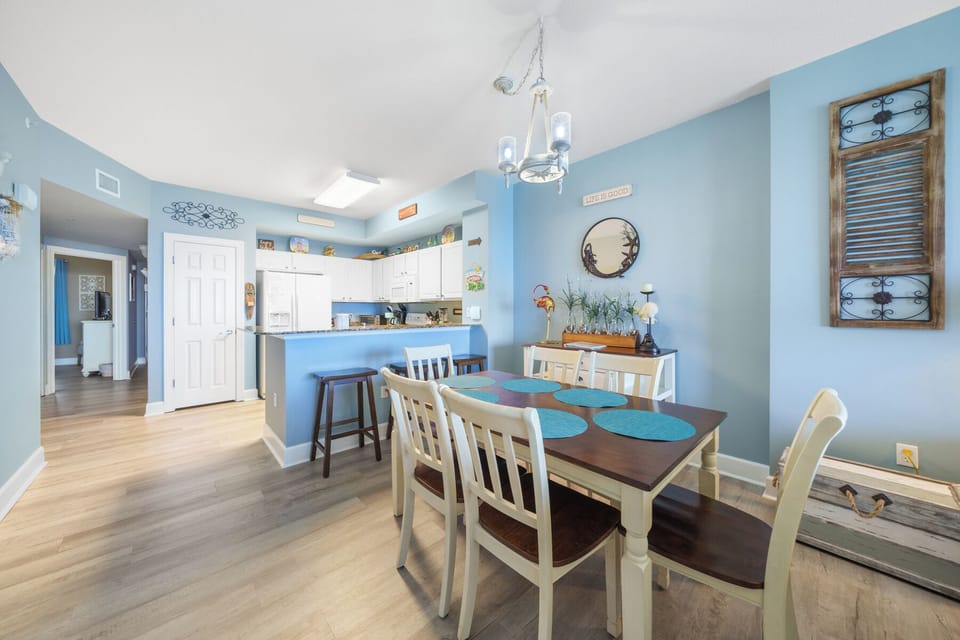 Seating for 6 at the dining table, with 3 bar stools at the kitchen counter.