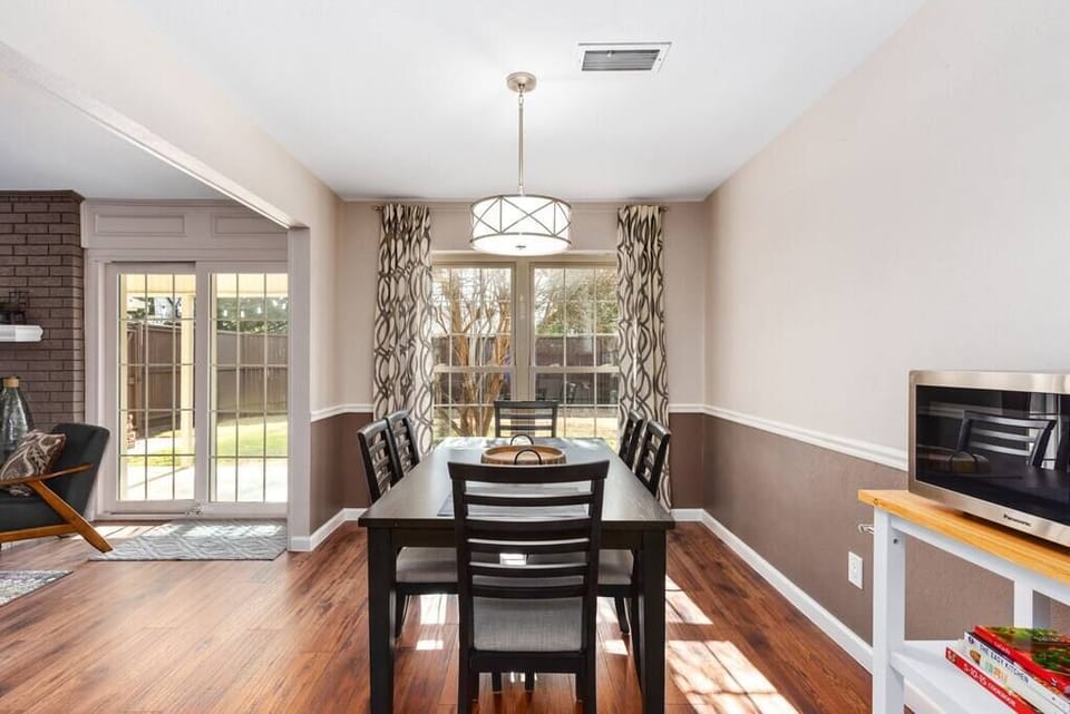 Sunny & bright dining room with table seating for 6.