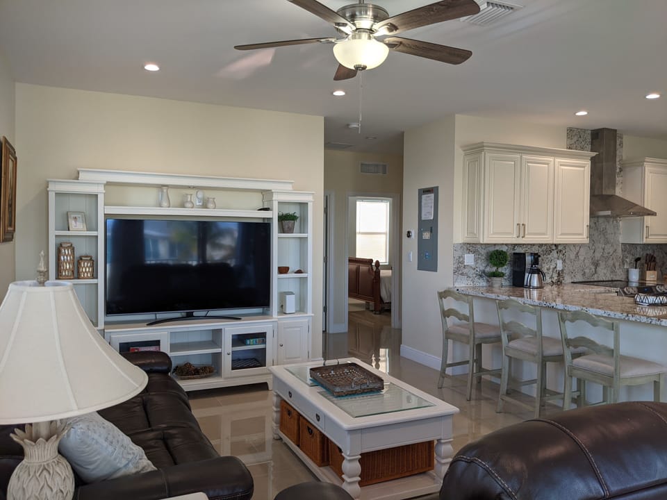 Catch up on the news or unwind while watching a movie on the 64" Smart HDTV.