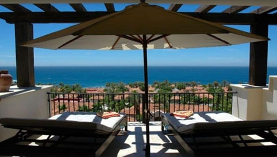 Private master balcony with lounging chairs looking out to the Sea Cortez.