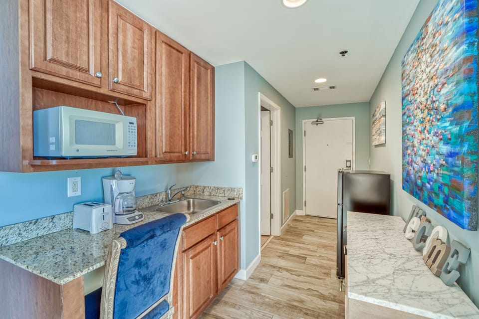King bed and sleeper sofa (sleeps 3), bathroom, kitchenette, private balcony