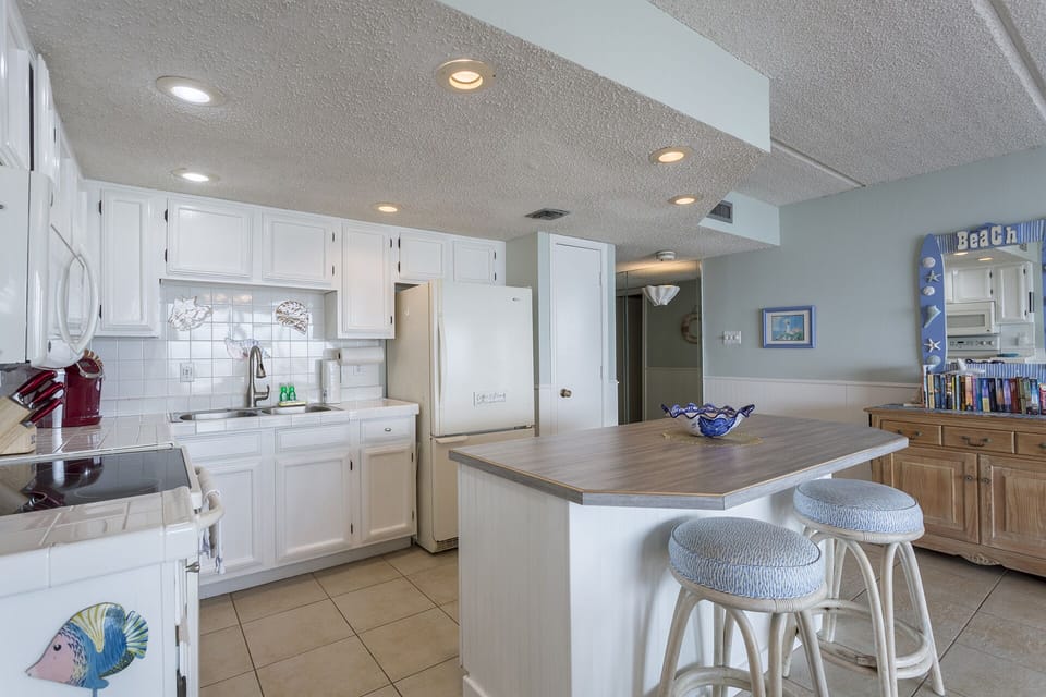Kitchen includes extra seating for 2 at the island bar