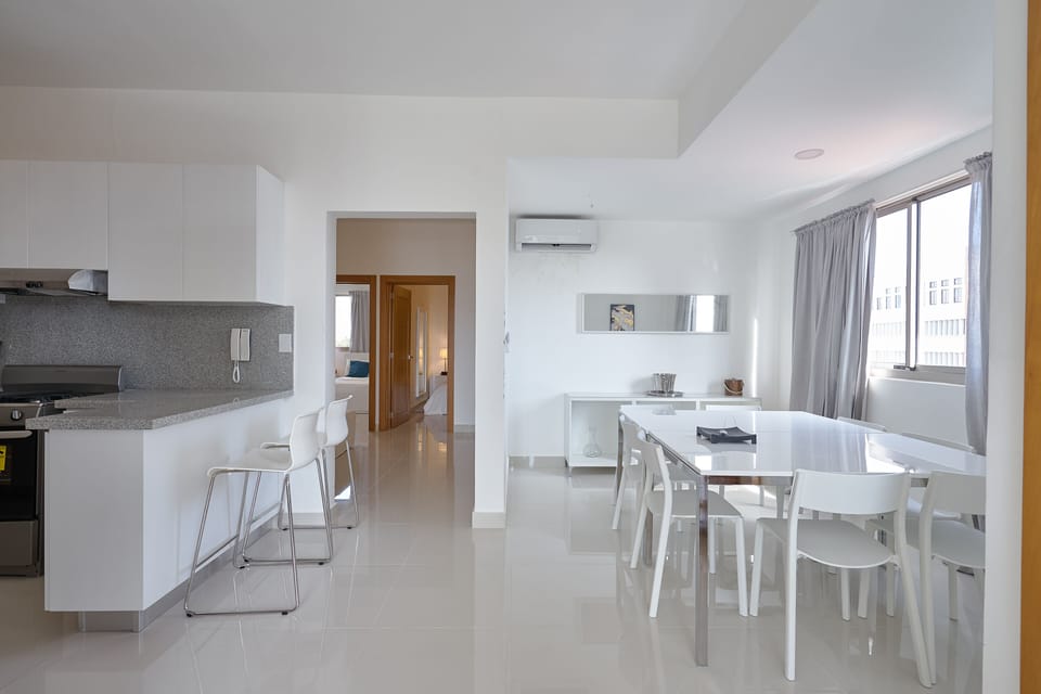 Breakfast Bar, Hallway to Bedrooms and The Great 8-Seat Dining Room