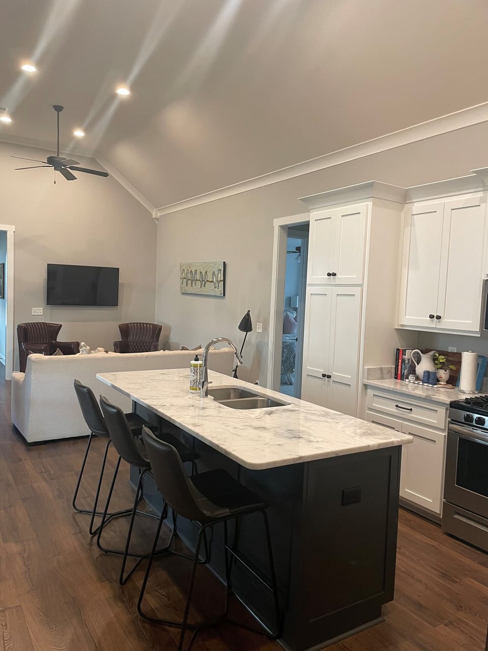 Kitchen- open floor plan- gas stove, microwave, side by side fridge