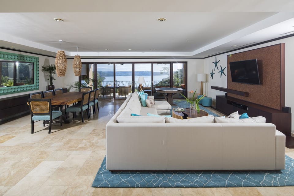 Open living and dining room with Sonos sound. 
