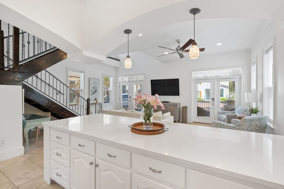 Sweeping Countertops in Kitchen with Plenty of Seating at Both Breakfast Bars