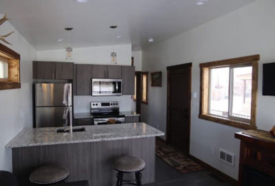 Beautiful  kitchen with full-size fridge, microwave, oven, dishwasher.