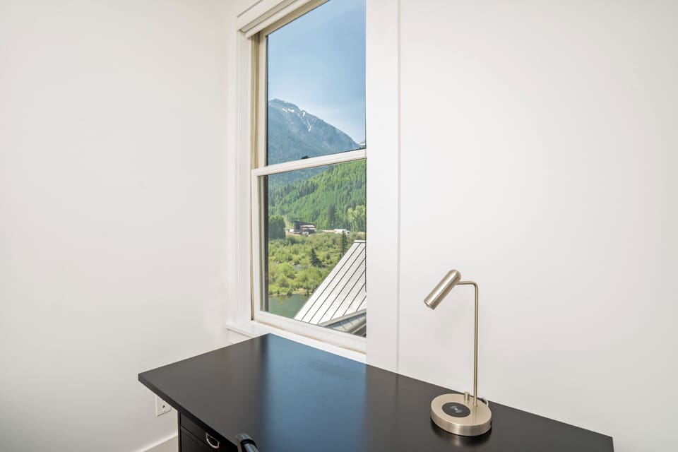 Desk workspace with views of Bear Creek

