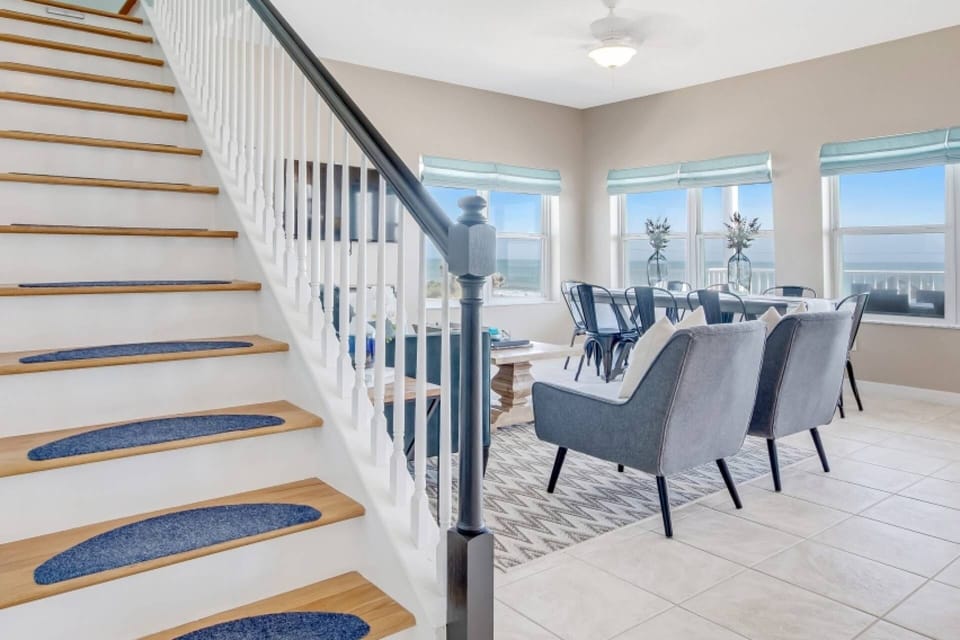 Ascend to the ultimate oceanfront retreat via this beautifully designed stairwell, connecting the main level to the top level.