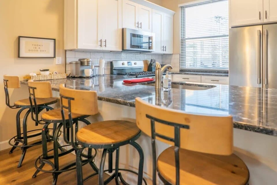 Pull up a seat at the island, perfect for quick breakfasts, coffee chats, or keeping the cook company. #KitchenIsland #MorningCoffee