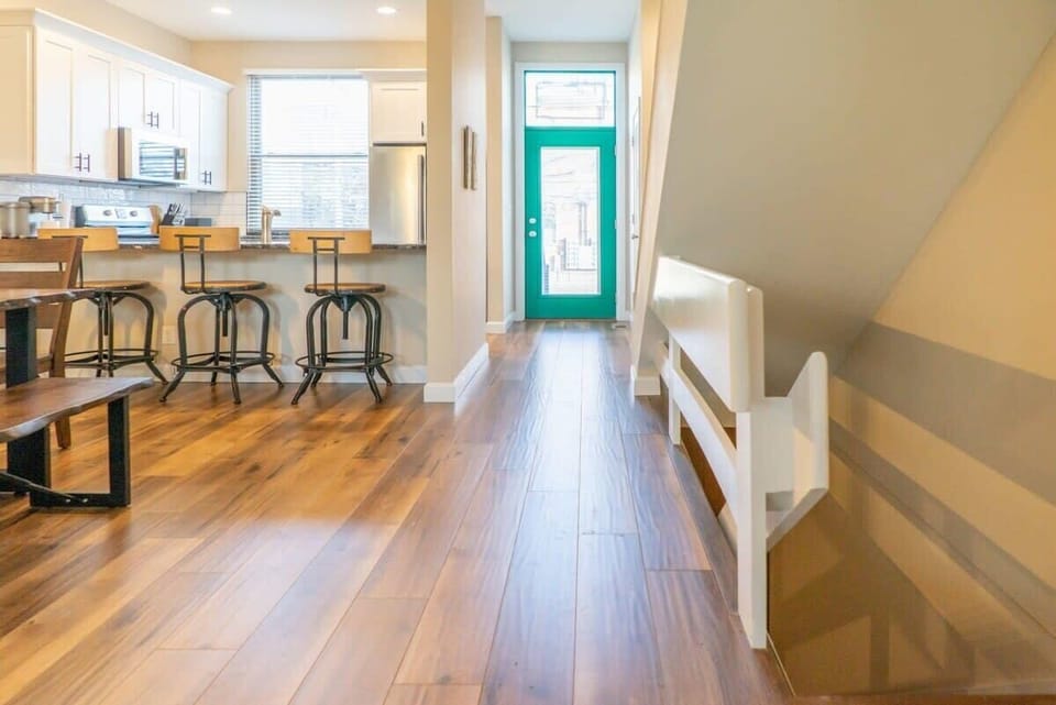 Open main floor layout with easy access downstairs to the game room and additional space. #VacationConvenience