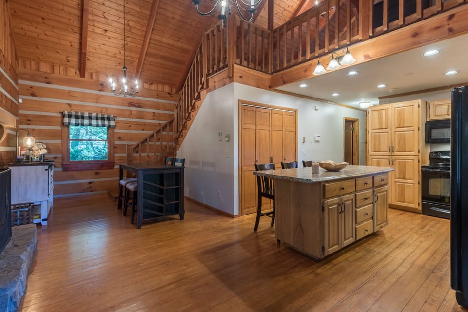 Breakfast nook next stone wood burning fireplace