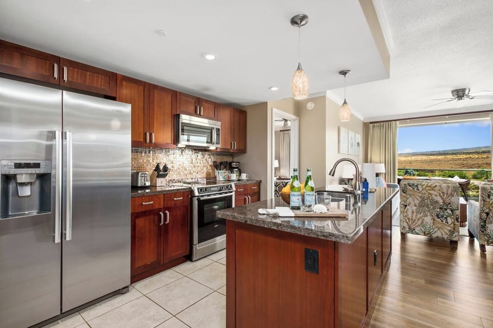 Fully equipped modern kitchen with scenic view and elegant finishes.