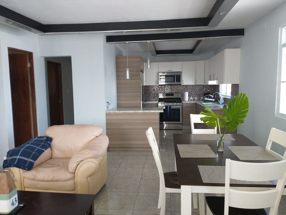 living room and dinning room with air conditioner, tv smart abd Wifi. 