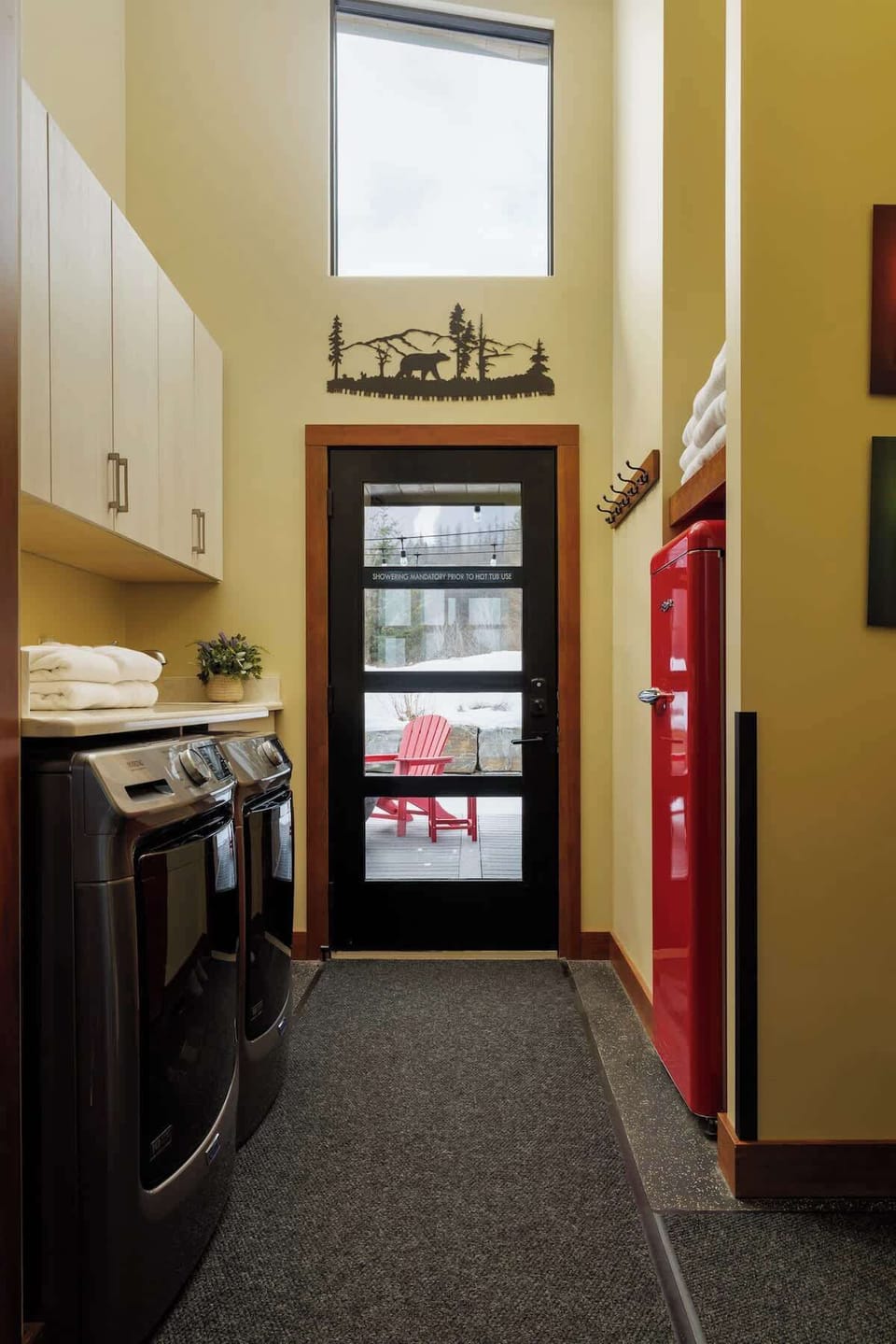 A practical mudroom with laundry and patio access.