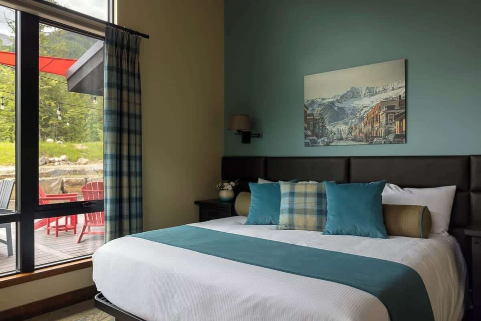 Calm bedroom with natural light and soft tones.